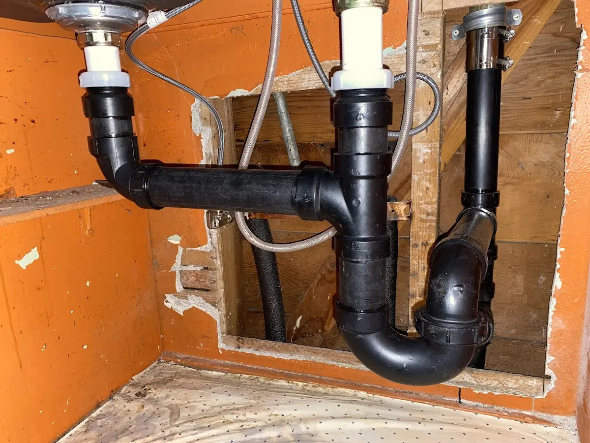 Professional Garbage Disposal Repair equipment and tools on the job in Kenmore